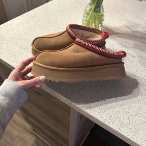 UGG Tan Slip-On Shoes with Red Trim
